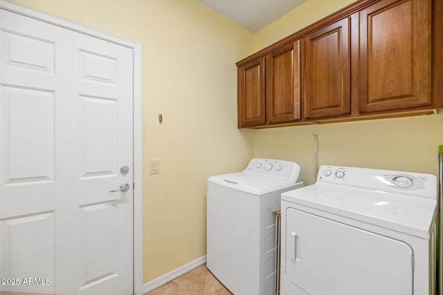 3932 E Melinda Dr, Phoenix, AZ 85050 - laundry room featuring baseboards, light tile patterned floors, cabinet space, and washer and clothes dryer