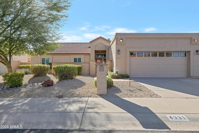 view of front of property with a garage