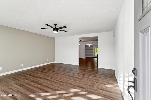 8420 E Hubbell St, Scottsdale, AZ 85257 - unfurnished room with ceiling fan, wood finished floors, a textured ceiling, and baseboards