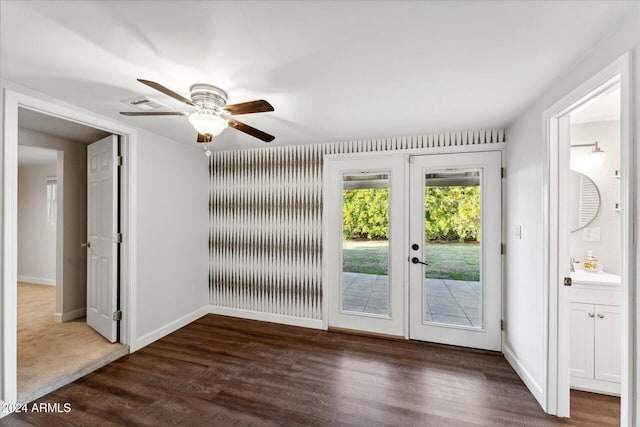 interior space with french doors, ceiling fan, and dark wood-type flooring