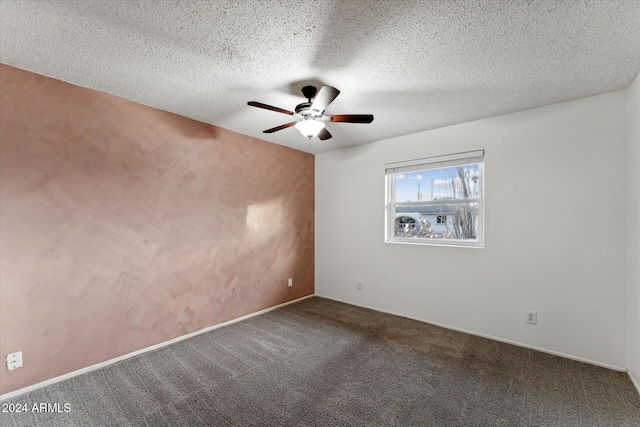 empty room featuring carpet, a textured ceiling, and ceiling fan