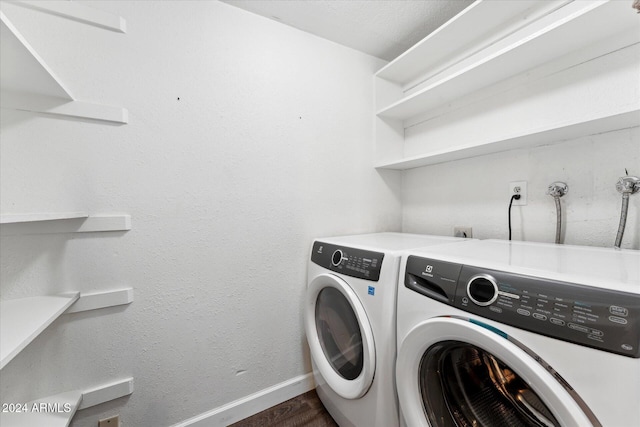 washroom featuring dark hardwood / wood-style floors and independent washer and dryer