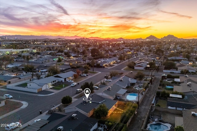 aerial view at dusk with a mountain view