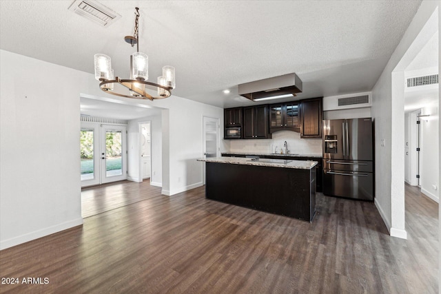 8420 E Hubbell St, Scottsdale, AZ 85257 - kitchen with stainless steel fridge with ice dispenser, a chandelier, dark wood-style flooring, a kitchen island, and a textured ceiling