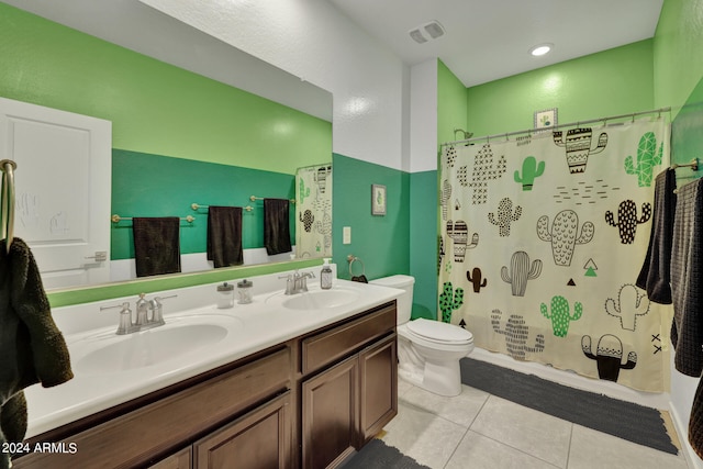 bathroom featuring a shower with shower curtain, tile patterned floors, vanity, and toilet