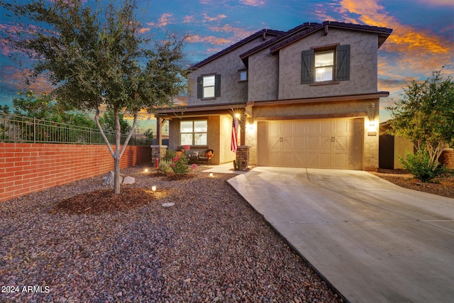 front of property with a garage