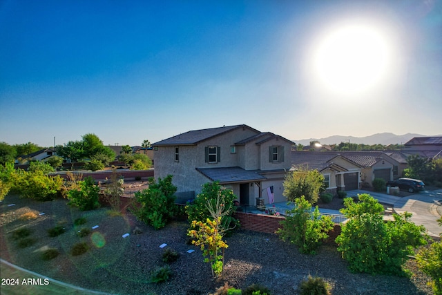 view of front of house featuring a garage and a mountain view