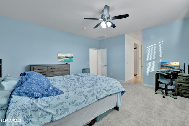 bedroom featuring light carpet and ceiling fan