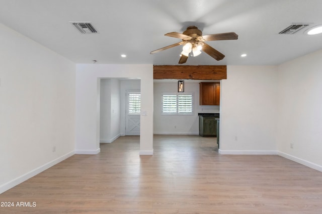 empty room featuring light wood-type flooring and ceiling fan