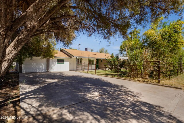 ranch-style house featuring a garage