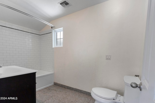 full bathroom with tiled shower / bath combo, vanity, and toilet