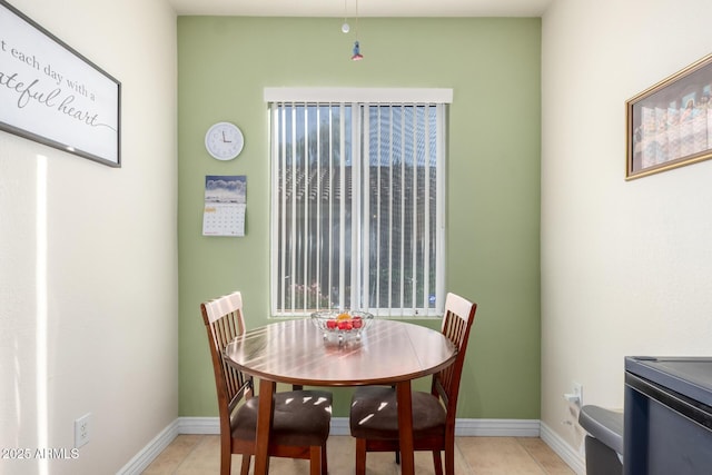 dining room featuring light tile patterned floors