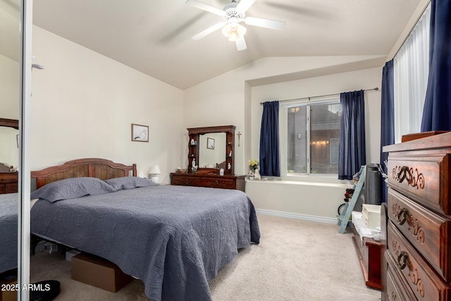 carpeted bedroom featuring ceiling fan and vaulted ceiling