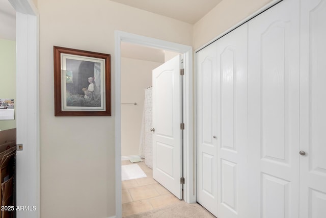 hallway featuring light tile patterned flooring