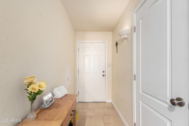 entryway featuring light tile patterned floors