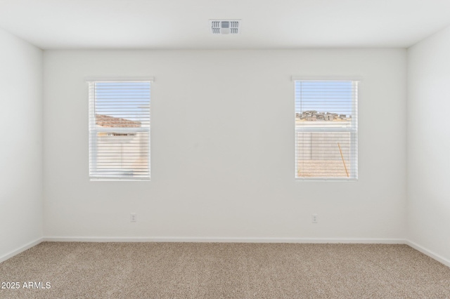 17806 W Vogel Ave, Waddell, AZ 85355 - carpeted spare room with baseboards and plenty of natural light