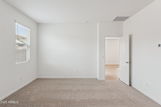 17806 W Vogel Ave, Waddell, AZ 85355 - spare room with light colored carpet and baseboards