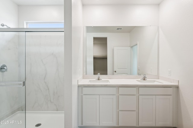 17806 W Vogel Ave, Waddell, AZ 85355 - bathroom with a marble finish shower and double vanity