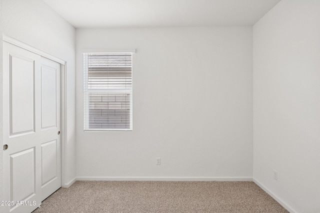 17806 W Vogel Ave, Waddell, AZ 85355 - unfurnished bedroom featuring light carpet and baseboards