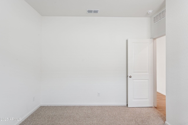 17806 W Vogel Ave, Waddell, AZ 85355 - empty room featuring light colored carpet, baseboards, and a smoke detector
