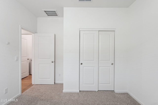 17806 W Vogel Ave, Waddell, AZ 85355 - unfurnished bedroom featuring carpet, baseboards, and a closet