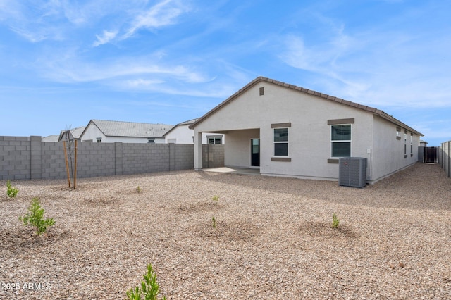 17806 W Vogel Ave, Waddell, AZ 85355 - rear view of house featuring central air condition unit, a fenced backyard, a patio, and stucco siding
