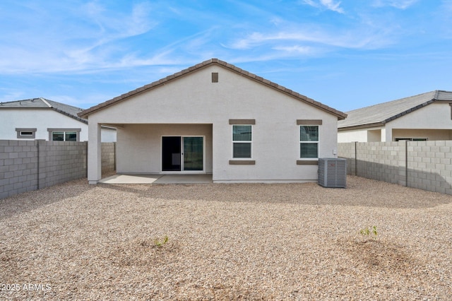 17806 W Vogel Ave, Waddell, AZ 85355 - back of property with a fenced backyard, central AC, a patio, and stucco siding