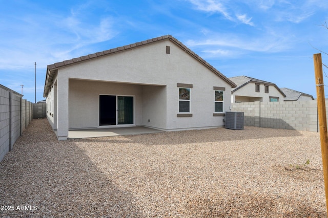 17806 W Vogel Ave, Waddell, AZ 85355 - rear view of property featuring cooling unit, a patio, a fenced backyard, and stucco siding