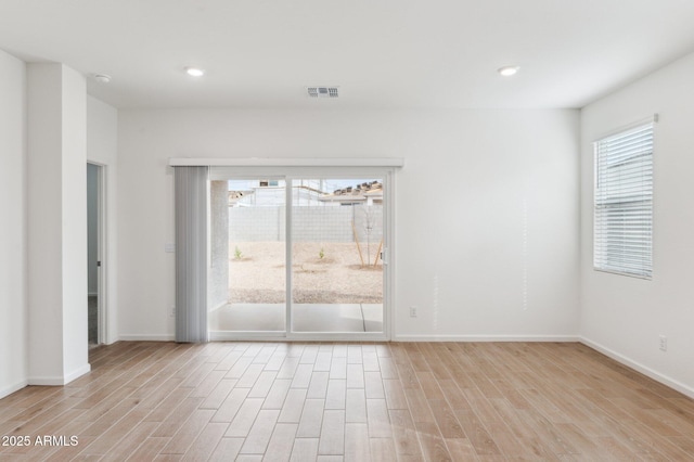 17806 W Vogel Ave, Waddell, AZ 85355 - empty room with wood finished floors, baseboards, a smoke detector, and recessed lighting