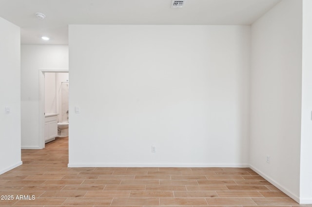 17806 W Vogel Ave, Waddell, AZ 85355 - empty room featuring light wood-style flooring, recessed lighting, and baseboards