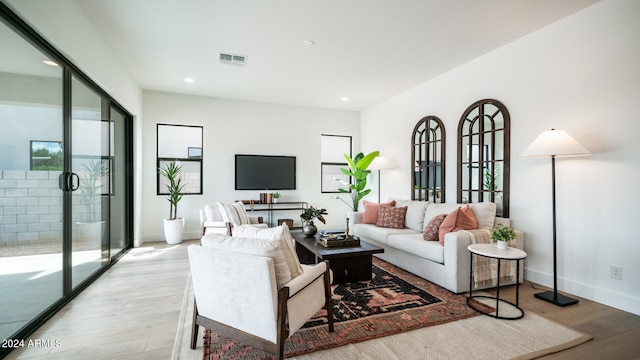 living room with light hardwood / wood-style floors