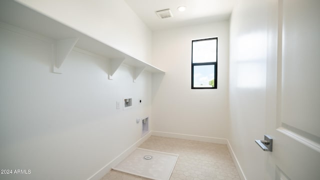 laundry area with electric dryer hookup, gas dryer hookup, and washer hookup