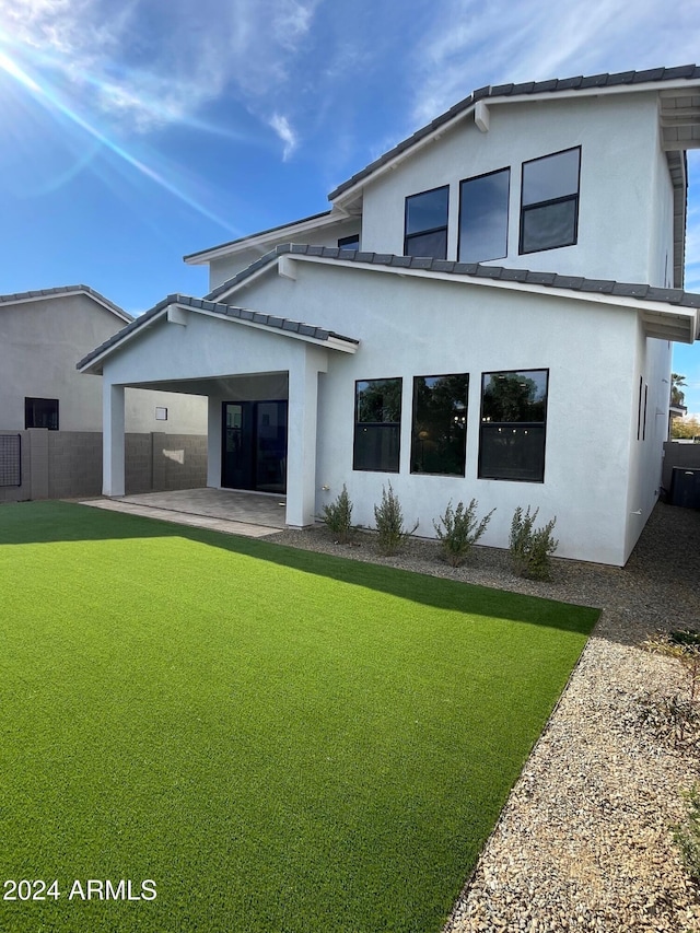 back of property with a patio area