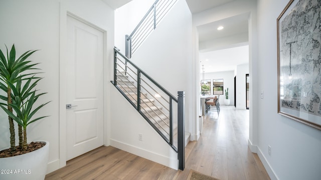 stairs featuring hardwood / wood-style flooring