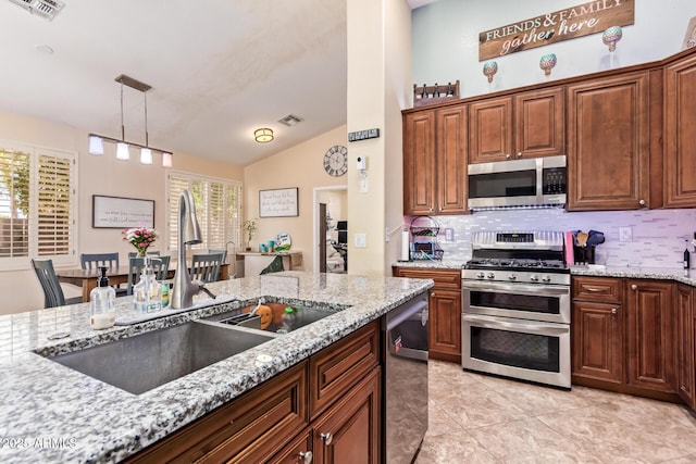 3823 E Kroll Dr, Gilbert, AZ 85234 - kitchen with stainless steel appliances, a sink, backsplash, pendant lighting, and light stone counters