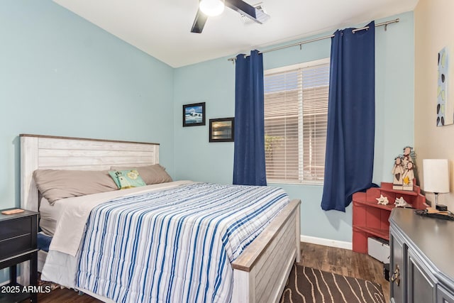 3823 E Kroll Dr, Gilbert, AZ 85234 - bedroom with dark wood-style flooring, a baseboard heating unit, baseboards, and a ceiling fan