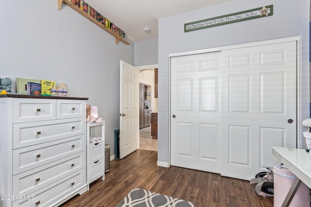 3823 E Kroll Dr, Gilbert, AZ 85234 - bedroom with dark wood-style flooring and a closet