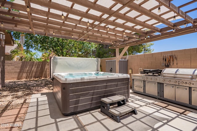 3823 E Kroll Dr, Gilbert, AZ 85234 - view of patio / terrace with a hot tub, a fenced backyard, and exterior kitchen