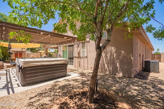 3823 E Kroll Dr, Gilbert, AZ 85234 - view of patio featuring a hot tub, central AC unit, a pergola, and a fenced backyard