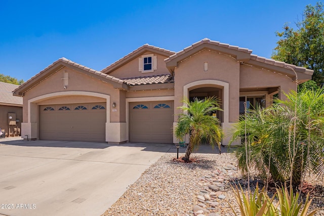 3823 E Kroll Dr, Gilbert, AZ 85234 - view of front of home with stucco siding, a garage, a tile roof, and driveway