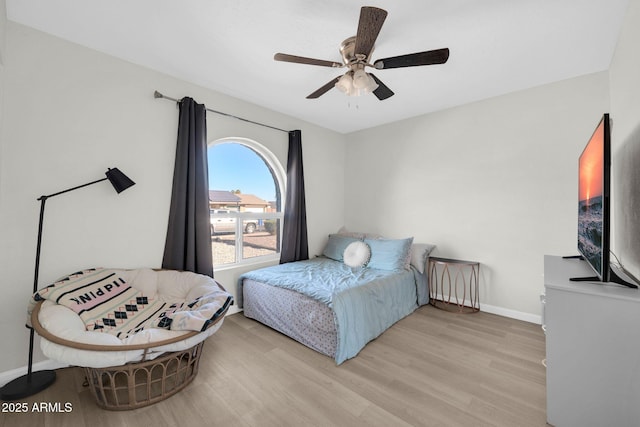 bedroom featuring ceiling fan and light hardwood / wood-style flooring