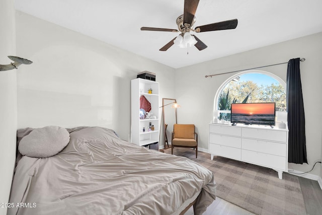 bedroom with wood-type flooring and ceiling fan