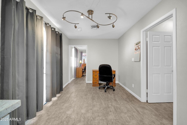 home office with light wood-type flooring