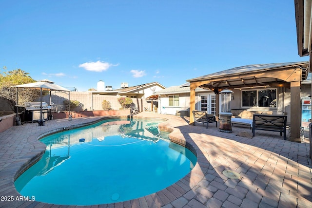 view of swimming pool with a patio, a gazebo, and area for grilling