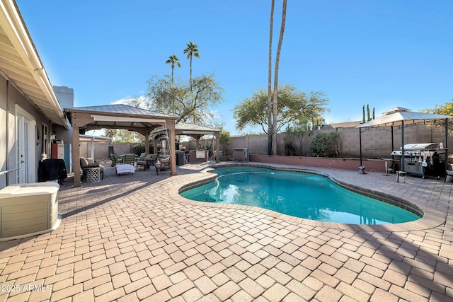 view of swimming pool with a gazebo and a patio