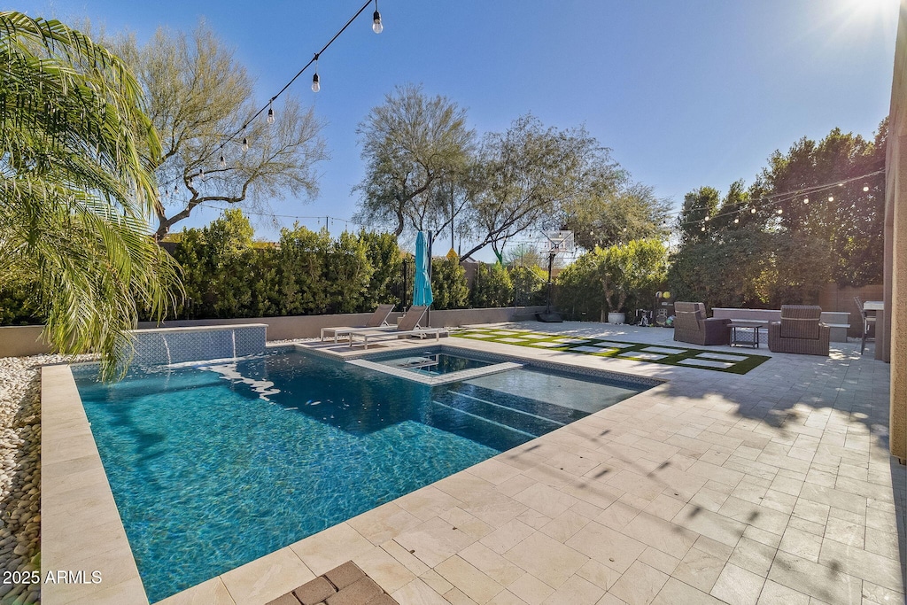 view of swimming pool featuring an in ground hot tub, a patio area, and pool water feature