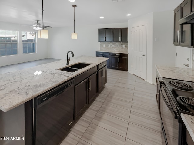 kitchen featuring hanging light fixtures, ceiling fan, tasteful backsplash, black appliances, and sink