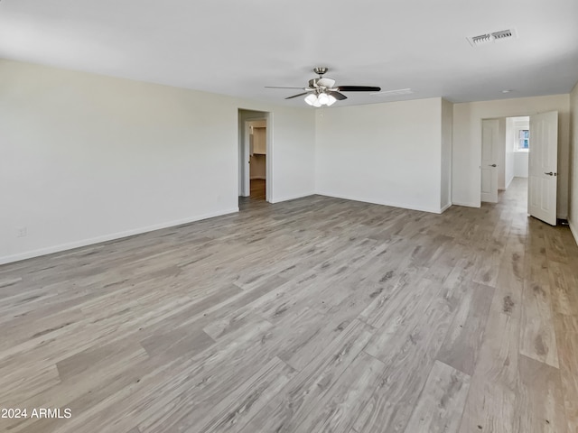 spare room with ceiling fan and light hardwood / wood-style flooring