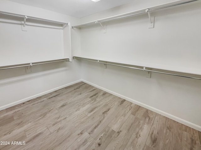 walk in closet featuring light wood-type flooring