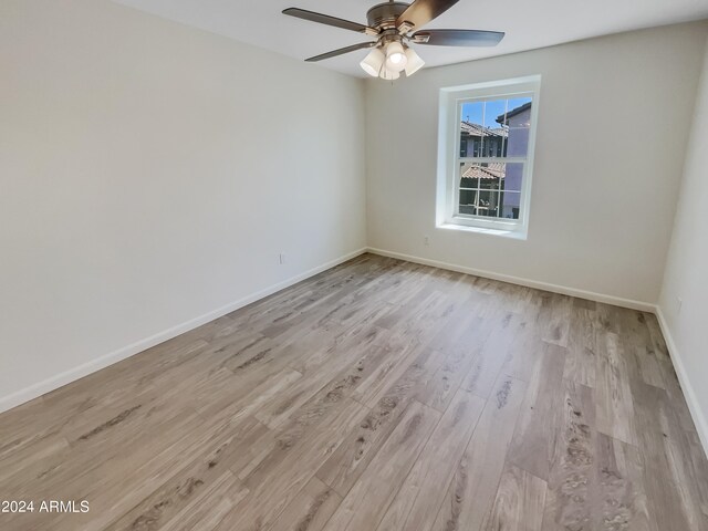 unfurnished room featuring ceiling fan and light hardwood / wood-style floors